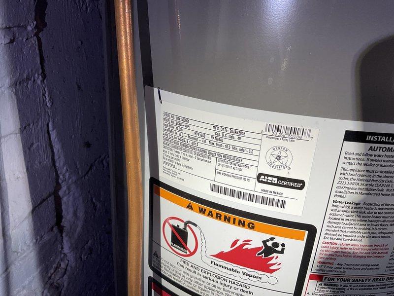 Responded to no hot water complaint on 11-year-old 40-gallon gas water heater producing only lukewarm water between 8am-12pm. Upon inspection, found unit with no pilot light and standard venting configuration. Given the age of the equipment and lack of hot water production, recommended complete water heater replacement as the most cost-effective solution.