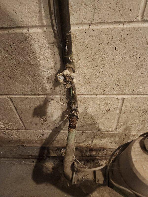 Responded to a water leak emergency caused by severely corroded and deteriorated main water intake valves at the meter location. The original valve had broken and fallen off due to extensive rust and brittleness. Coordinated with the water department to shut off water supply at the curb stop to safely perform repairs. Replaced the valve before the water meter and the valve after the meter, along with a damaged section of copper piping. All corroded components were removed and new valves and piping were installed to restore proper water service and prevent future leaks. System was tested and returned to full operation. Technician will return later today to complete final inspection and any remaining work.