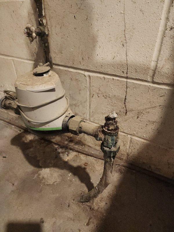 Responded to a water leak emergency caused by severely corroded and deteriorated main water intake valves at the meter location. The original valve had broken and fallen off due to extensive rust and brittleness. Coordinated with the water department to shut off water supply at the curb stop to safely perform repairs. Replaced the valve before the water meter and the valve after the meter, along with a damaged section of copper piping. All corroded components were removed and new valves and piping were installed to restore proper water service and prevent future leaks. System was tested and returned to full operation. Technician will return later today to complete final inspection and any remaining work.