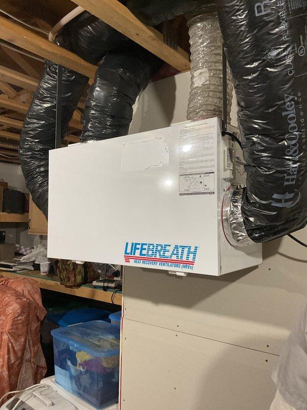 Performed comprehensive inspection of LifeBreath Heat Recovery Ventilator (HRV) system that had not been operated in six years. Verified unit operational status, inspected all ductwork connections and airflow pathways, and confirmed mechanical components functioning properly. Unable to locate dedicated wall control or thermostat for HRV operation; system likely controlled by integrated sensor or automated control sequence within the unit itself.