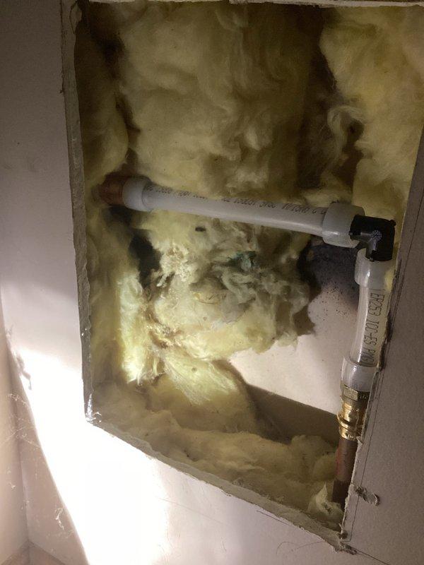 Responded to a leaking outdoor hose bibb that required the interior water supply to be shut off to prevent continuous water discharge. Accessed the supply line through an interior wall cavity, removed the failed hose bibb, and installed a new copper hose bibb assembly on the exterior siding. Restored water supply and verified proper operation with no leaks detected at the connection point.