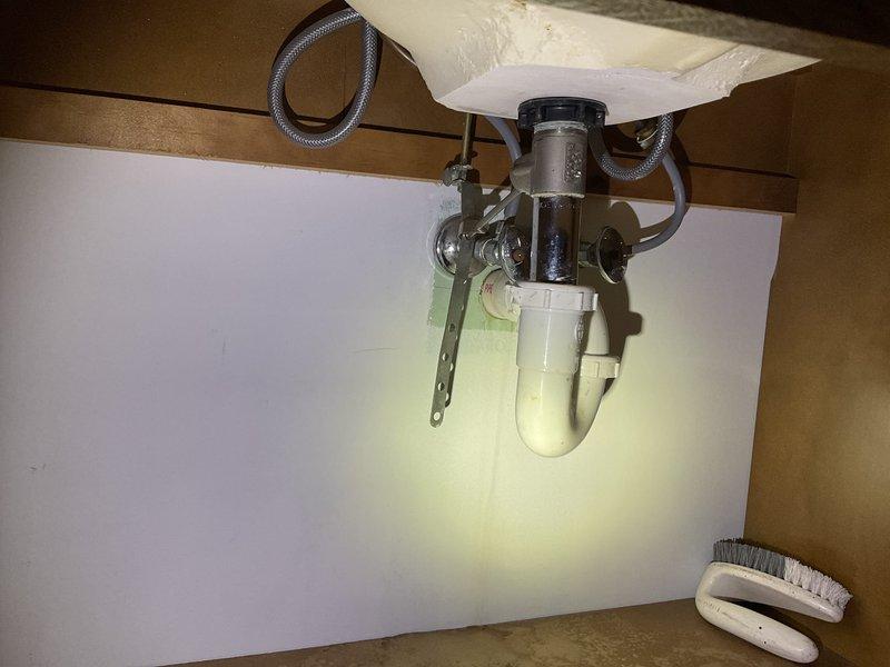 Attempted to perform comprehensive plumbing inspection as part of coordinated HVAC, plumbing, and electrical final rough-in assessment. Inspection could not be completed due to absence of electrical power in the residence and lack of available water supply from the well system. Visual documentation was captured of accessible plumbing fixtures including shower valve assembly with mounted accessories and under-sink drain configuration with P-trap and supply lines. Inspection to be rescheduled once power is restored and premises are prepared for final assessment.
