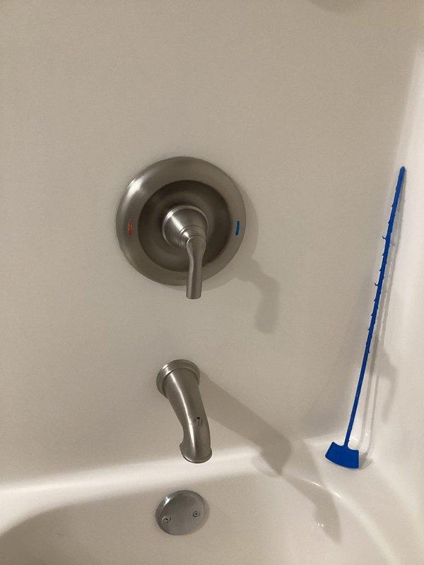 Conducted on-site assessment for shower and tub fixture installations in master and guest bathrooms. Evaluated existing plumbing conditions and identified multiple failing components requiring replacement, including a broken tub spout, leaking and corroded shower valve, and deteriorated tub drain assembly. Documented current fixture conditions through photographic documentation showing the single-handle shower/tub control valve with visible corrosion, compromised tub spout, and drain components in need of replacement. Provided comprehensive estimate for installation of customer-supplied shower fixtures and replacement of all failing plumbing components to restore proper function and prevent water damage.