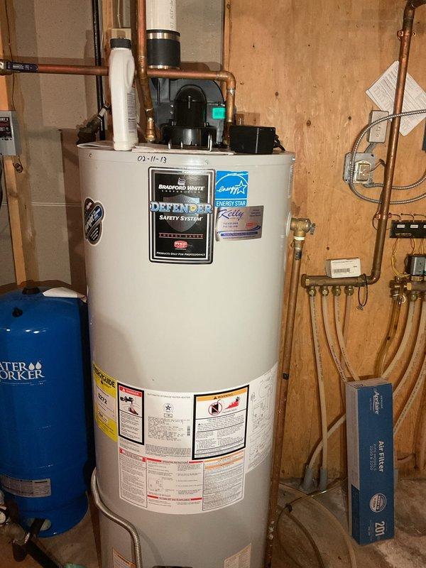 Responded to service call for water leaking in and around furnace. Upon inspection, identified failed seal between inducer motor and collector box, along with a compromised heat exchanger ring on deck causing water intrusion. Extensive rust and corrosion observed on furnace support framework and housing components, indicating prolonged moisture exposure. Documented equipment condition with photographs showing corroded metal surfaces, deteriorated seals, and water damage. Consulted with property contact on-site regarding findings and recommended furnace replacement due to heat exchanger failure and extent of water damage to critical components.