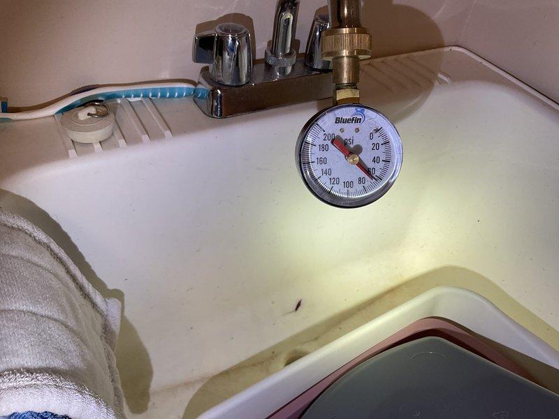Completed comprehensive plumbing inspection of residential property with no operational issues identified. Water pressure tested at sink fixture using calibrated gauge, readings within normal parameters. Recommended water treatment system installation due to visible mineral staining and discoloration observed in basin, indicating hard water conditions that may affect plumbing fixtures and appliances long-term.