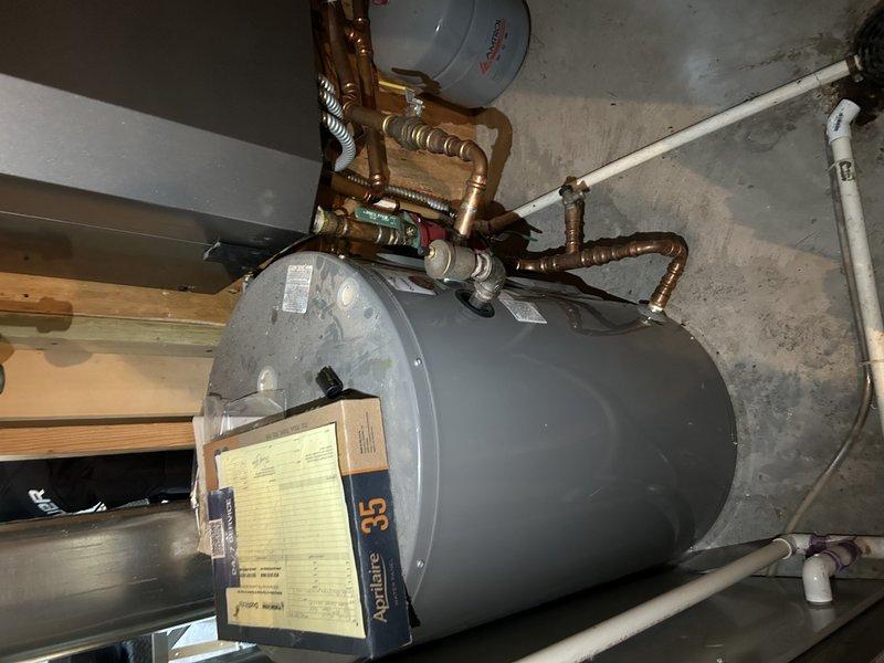 Responded to service call for NTI boiler providing basement in-floor heat that was not maintaining proper temperature, heating only to 67 degrees despite being set to 85 degrees. Diagnosed system and found it was low on water due to a malfunctioning backflow preventer that was preventing water from entering the system. Disconnected the backflow prevention device and performed testing to confirm proper water flow and verify the backflow preventer itself was the source of the obstruction. Ordered replacement part to restore system to proper operation and ensure consistent in-floor heating performance.