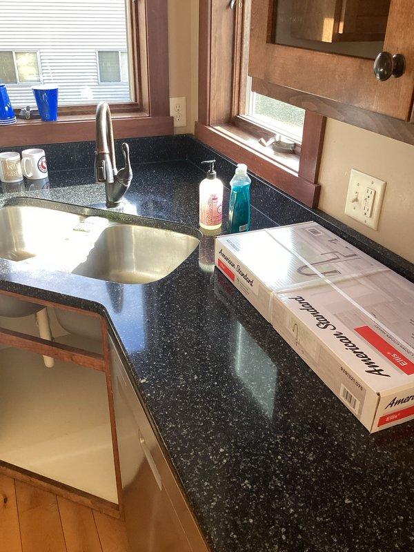 Completed multiple plumbing installations and repairs including disconnecting and capping dishwasher supply and drain lines for customer removal. Installed customer-supplied kitchen faucet at undermount sink with granite countertop, ensuring proper connections and testing for leaks. Removed existing toilet in master bathroom and installed new comfort height toilet with proper wax ring seal and water supply connection. In guest upstairs bathroom, replaced fill valve and flush seal assembly to restore proper tank function and eliminate running water issues. All fixtures tested and verified operational upon completion.