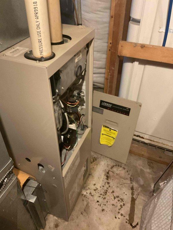 Replaced defective combustion draft inducer assembly on residential furnace unit located in basement mechanical room. Removed failed inducer motor, installed new assembly, and verified proper operation of pressure switch connections and PVC venting system. Conducted complete system test upon completion to ensure proper draft operation, ignition sequence, and overall furnace functionality.