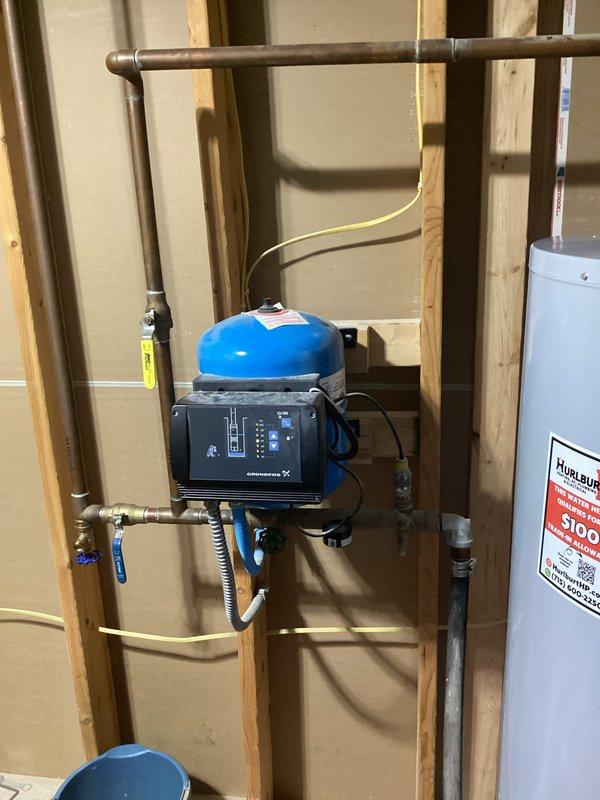 Responded to service call for leaking electric water heater with water discharge from bottom of unit. Removed failed water heater and installed replacement A.O. Smith electric water heater under parts warranty coverage. Completed full removal and replacement including all necessary connections to existing copper supply lines and electrical service, proper disposal of defective unit, and return of old water heater to shop with warranty documentation attached. Verified new installation for proper operation, tested all connections for leaks, and confirmed pressure tank and control system integration with new water heater. System restored to full operational status.
