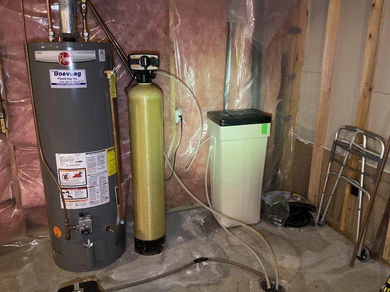 Responded to service call for malfunctioning water softener with excessive water accumulation in the tank. Upon inspection, determined the unit was inoperative and beyond economical repair. Assessed the existing water treatment system configuration in the basement utility area, including connections to the water heater and plumbing infrastructure. Provided estimate for complete water softener replacement system, which was approved by the customer with downpayment processed for scheduled installation.