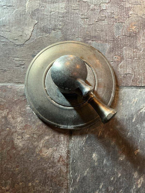 Responded to a dual plumbing issue involving a leaking Delta shower valve and a clogged kitchen sink drain. Upon inspection, found the shower valve cartridge was failing and causing water to leak from the handle. Replaced the Delta cartridge to restore proper function and eliminate the leak.

For the kitchen sink, diagnosed a grease blockage in the horizontal drain section before the vertical drop. The homeowner had previously attempted to clear the obstruction and noted a gel-like substance in the pipes. Used a drain auger to break up the grease accumulation, then employed a blow bag to fully clear the line and restore proper drainage. The blockage was successfully removed from the accessible horizontal pipe section without requiring extensive disassembly of the drain system.