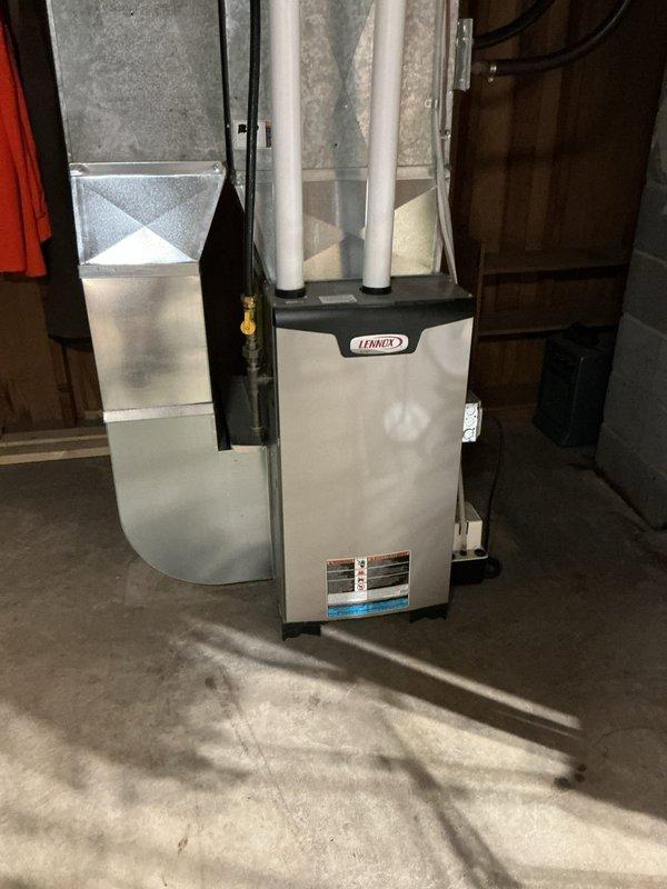 Responded to no hot water call on electric water heater. Customer was transitioning from wood boiler heating system back to electric water heater for seasonal operation. Found tripped high-temperature limit switch on unit. Reset the limit switch and restored hot water operation. Provided customer with verbal instructions on proper startup procedure for future seasonal conversions from wood boiler to electric water heater system.
