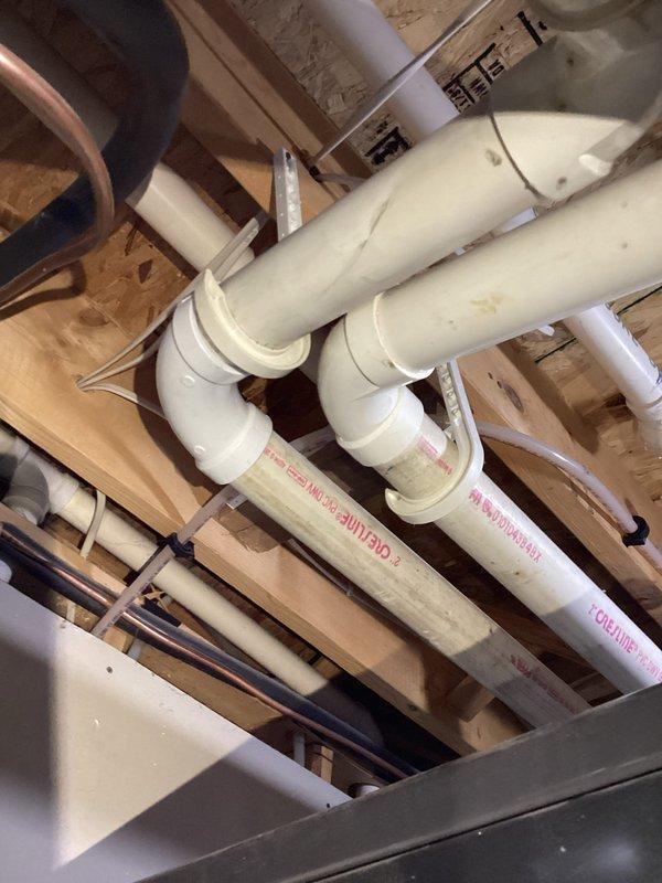 Responded to furnace exhaust pipe leak in utility space. Upon inspection, identified failed 2-inch PVC elbow fitting on vent pipe system causing water dripping from condensate line leading outside. Removed defective elbow, installed new 2-inch PVC elbow with proper primer and cement application, and verified all connections were secure. Ran furnace for approximately 10 minutes to test system under normal operating conditions and confirmed leak was eliminated with no further dripping observed.