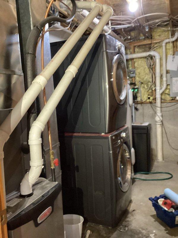 Responded to furnace exhaust pipe leak in utility space. Upon inspection, identified failed 2-inch PVC elbow fitting on vent pipe system causing water dripping from condensate line leading outside. Removed defective elbow, installed new 2-inch PVC elbow with proper primer and cement application, and verified all connections were secure. Ran furnace for approximately 10 minutes to test system under normal operating conditions and confirmed leak was eliminated with no further dripping observed.