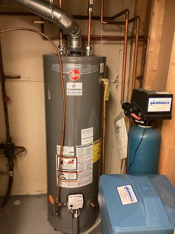 Responded to service call for non-functioning washing machine valve that would not turn due to age-related deterioration. Assessed valve condition and provided estimate for replacement of either the single faulty hot water valve or both valves as a preventative measure. Documented existing plumbing configuration in basement utility area, including water heater connections, copper piping, and associated fixtures to determine scope of valve replacement work required.