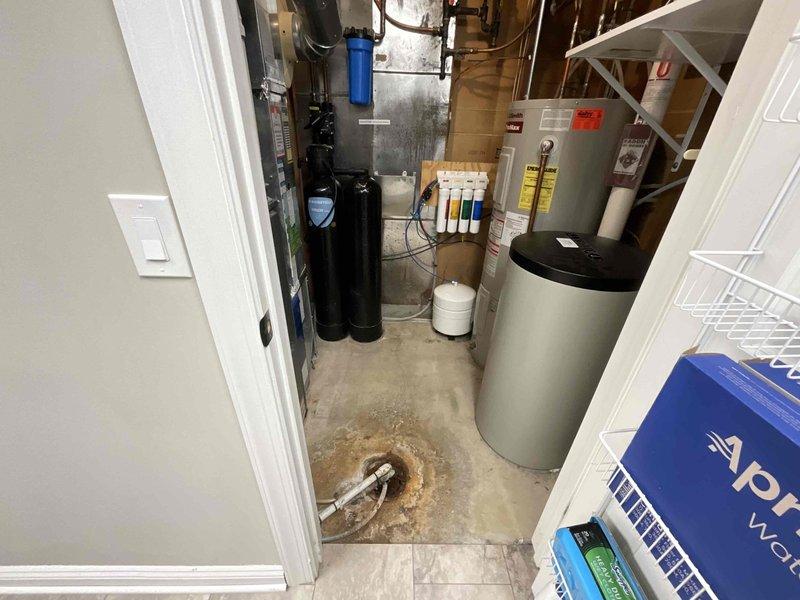 Responded to service call for 50-gallon electric water heater experiencing heating failure after approximately 15 minutes of use. Upon inspection, confirmed 17-year-old unit was no longer maintaining consistent hot water supply due to age-related component failure. Evaluated existing installation in mechanical room including water treatment system, copper supply lines, and electrical connections. Provided detailed estimate for complete water heater replacement including removal of existing unit, installation of new 50-gallon electric water heater with appropriate code-compliant connections, and disposal of old equipment.