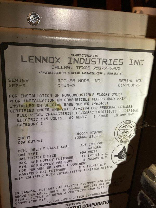 Responded to no heat call on Lennox XCB-5 series boiler with radiant heating system. Upon inspection, found boiler cycling through operation but failing to ignite. Diagnosed faulty pressure switch that was not closing properly. Temporarily restored operation by tapping pressure switch to unstick mechanism, allowing boiler to ignite and resume normal heating cycle. Drained waterlogged expansion tank and verified system pressure within acceptable range. Recommended pressure switch replacement as current unit is likely to stick again during future cycles. Proper replacement part to be ordered and installed on follow-up visit. Boiler currently operational and providing heat. Also noted significant sediment accumulation in water heater during inspection and recommended future replacement consideration.