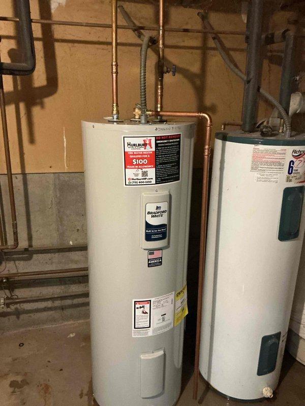 Responded to service call for a 1999 Richmond 59-gallon electric water heater experiencing active leakage from the top of the unit. Upon inspection, determined the leak originated from the upper connections and that the age and condition of the unit warranted full replacement rather than repair. Removed and properly disposed of the failed water heater. Installed a new 50-gallon electric water heater with proper copper piping connections, pressure relief valve, and shutoff valves. Tested all connections for leaks, verified proper electrical operation, and ensured unit was functioning correctly before completing the installation.