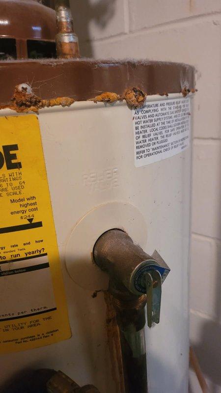Responded to a water heater failure caused by severe tank corrosion and rust perforation at the bottom, resulting in active leaking. Removed and replaced the failed 40-gallon natural gas water heater with a new unit, completed all necessary plumbing connections, and enrolled the property in a maintenance membership program.