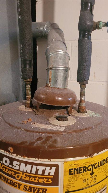 Responded to a water heater failure caused by severe tank corrosion and rust perforation at the bottom, resulting in active leaking. Removed and replaced the failed 40-gallon natural gas water heater with a new unit, completed all necessary plumbing connections, and enrolled the property in a maintenance membership program.