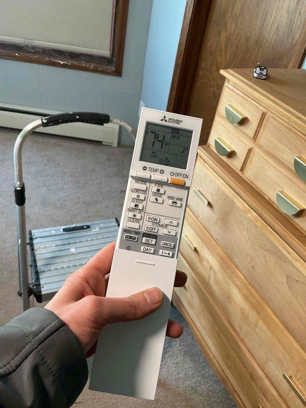 Responded to service call for newly installed Mitsubishi Electric mini-split system in upstairs bedroom with non-responsive vane and fan controls on remote. Diagnosed faulty remote control unit unable to communicate directional vane commands while heating function remained operational. Ordered replacement OEM Mitsubishi Electric remote control to restore full functionality of ceiling-mounted indoor unit including airflow direction and fan speed settings.
