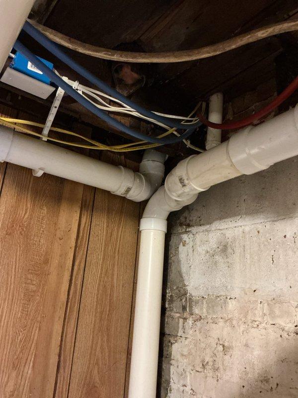 Completed comprehensive plumbing inspection as part of family rewards program. Thoroughly examined all accessible plumbing fixtures, supply lines, and drainage systems throughout the residence, including kitchen sink with dual-basin stainless steel configuration and spray attachment, as well as basement utility area plumbing connections and PVC drainage system. All components found to be in proper working order with no repairs required. Customer expressed interest in water softener installation; documented request for future quote preparation.