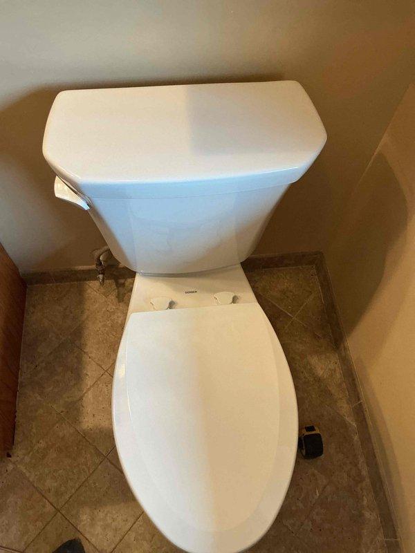 Responded to main bathroom toilet that continued running despite homeowner replacing all internal components. Upon inspection, discovered toilet was continuously leaking water into the bowl due to defective fixture that could not be repaired. Removed and disposed of faulty toilet unit along with corroded floor flange hardware. Installed new elongated standard height toilet with all necessary components including wax ring seal and supply line connection. Tested new installation for proper flush operation and verified no leaks present.