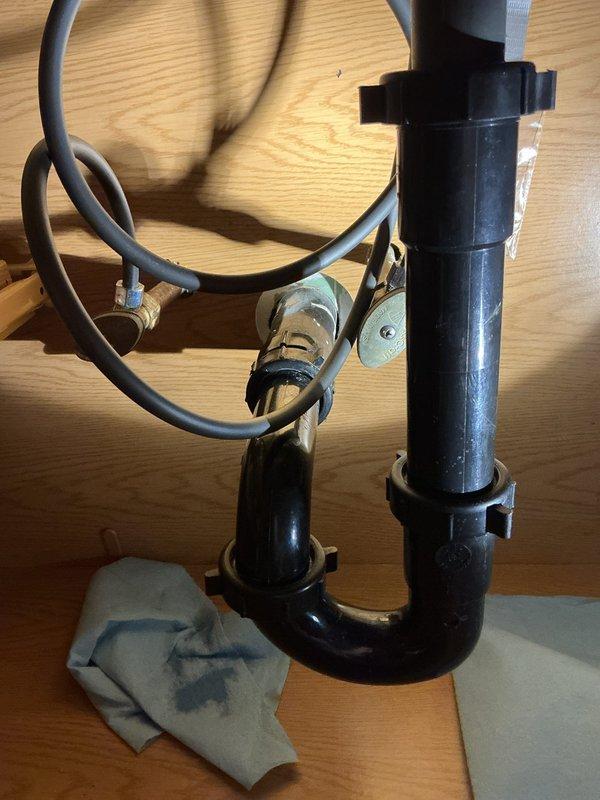 Responded to bathroom leak emergency where water supply to home was shut off due to failed vanity stop valves. Previous faucet replacement attempt was unsuccessful and not holding pressure. Successfully replaced defective angle stops under vanity sink to restore proper water shutoff capability and eliminate leaking. Removed old corroded brass stop valves and installed new compression-style stops with supply lines. Tested all connections for leaks and verified proper operation of shutoff valves before restoring water service to the home.