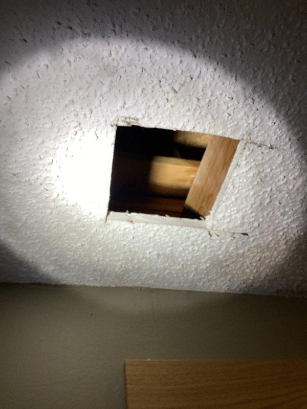 Responded to a ceiling water leak emergency and shut off the main water supply to the home to prevent further damage. Investigated the bathroom area but initially could not locate the source of the leak from below. Created ceiling access point to inspect the plumbing system above. Discovered a pinhole leak in the copper supply line feeding the shower valve. Removed the compromised section of copper piping and installed new copper supply line to the shower valve, restoring proper water flow and eliminating the leak.