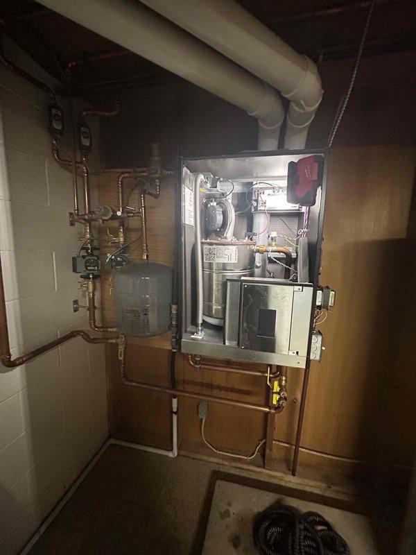 Performed comprehensive boiler maintenance on IBC VX150 system with Honeywell VisionPRO 8000 thermostat. Conducted thorough inspection of all standard components, tested both heating zones for proper operation, and verified system functionality. All components found to be in excellent condition with no issues identified. System operating within normal parameters.