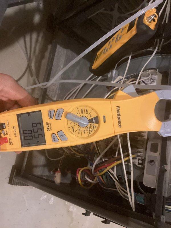 Performed comprehensive tune-up and inspection on 11-year-old Lennox furnace model ML193UH090XP48C-58 and associated HVAC equipment. Conducted full system safety assessment and operational testing of all components. 

During inspection, measured inducer motor amperage and found elevated readings indicating potential motor strain. Tested blower motor capacitor and determined readings were out of acceptable range, which could negatively impact blower performance and system efficiency. Inspected RenewAire Energy Recovery Ventilator unit and found air exchanger filter heavily soiled with debris, restricting proper airflow.

Documented all findings with digital meter readings and photographic evidence of equipment condition. Provided recommendations for blower capacitor replacement and air exchanger filter replacement to restore optimal system performance and prevent potential component failure. Confirmed furnace operating safely with all safety controls functioning properly. System left in