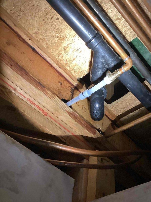 Responded to a return visit for a significant leak from a newly installed PEX flex line connected to the tub valve. Upon arrival, found that over 2 gallons of water had been collected and the water supply to the home had been shut off. Removed the defective PEX line section and installed replacement plumbing consisting of an elbow, two couplings, and an additional elbow to properly connect to the tub valve. Flushed the tub system and verified complete leak elimination with no further dripping observed.