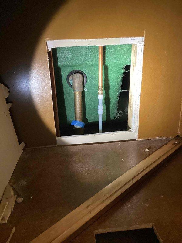 Responded to a return visit for a significant leak from a newly installed PEX flex line connected to the tub valve. Upon arrival, found that over 2 gallons of water had been collected and the water supply to the home had been shut off. Removed the defective PEX line section and installed replacement plumbing consisting of an elbow, two couplings, and an additional elbow to properly connect to the tub valve. Flushed the tub system and verified complete leak elimination with no further dripping observed.