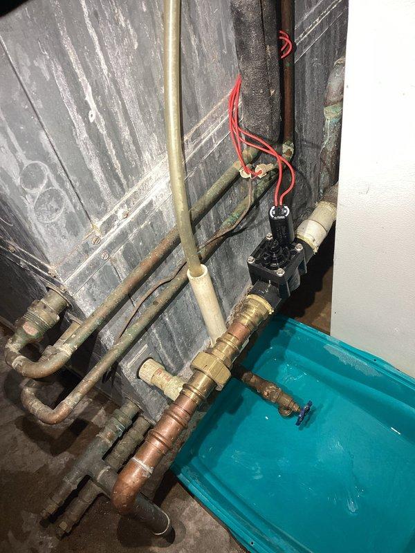Responded to recurring leak in geothermal zone valve that has required replacement twice in the past two years. Diagnosed active water leak at zone valve assembly and documented condition with photos showing corroded brass fittings and aged copper piping connections. Presented customer with repair options including replacement with standard plastic zone valve requiring periodic replacement every few years versus upgraded brass valve with potential noise concerns and no guaranteed improvement in longevity. Recommended maintaining current plastic valve specification and keeping spare unit on-site for future replacement due to straightforward installation process when proper valve is available.