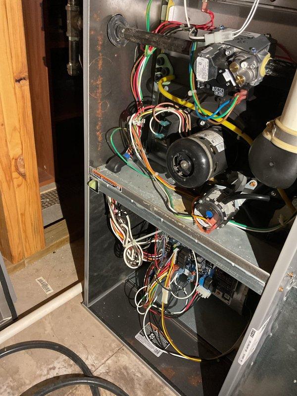 Completed annual A/C tuneup and heating system inspection per maintenance agreement. Performed exterior condenser coil cleaning despite 37° outdoor temperature, replaced air filter, and conducted thorough heat exchanger and evaporator coil inspection. Tested dual-run capacitor rated at 40/5 MFD, which measured 35/4.5 MFD indicating degradation below acceptable operating range, and provided quote for capacitor replacement to prevent future compressor or fan motor failure.