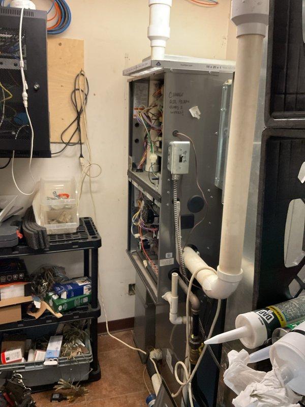 Responded to no heat call at commercial restaurant facility with multiple levels and two furnace units. Diagnosed upstairs furnace unit (12 years old) and identified failed ECM blower motor as cause of heating failure. Removed access panel, inspected internal components and control board, documented findings with photos. Submitted warranty claim information to parts department for motor replacement and awaiting customer approval on pricing for repair.