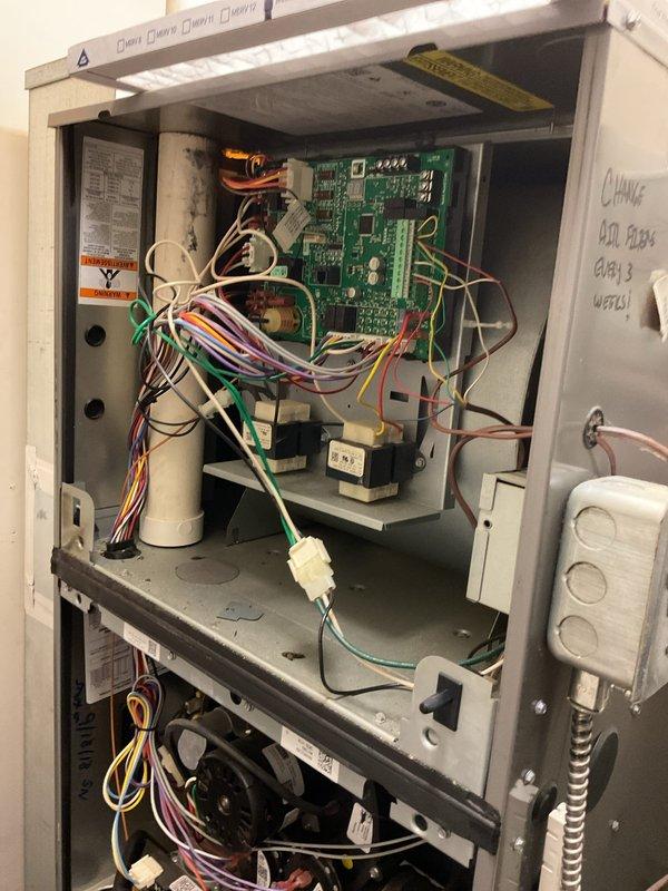 Responded to no heat call at commercial restaurant facility with multiple levels and two furnace units. Diagnosed upstairs furnace unit (12 years old) and identified failed ECM blower motor as cause of heating failure. Removed access panel, inspected internal components and control board, documented findings with photos. Submitted warranty claim information to parts department for motor replacement and awaiting customer approval on pricing for repair.