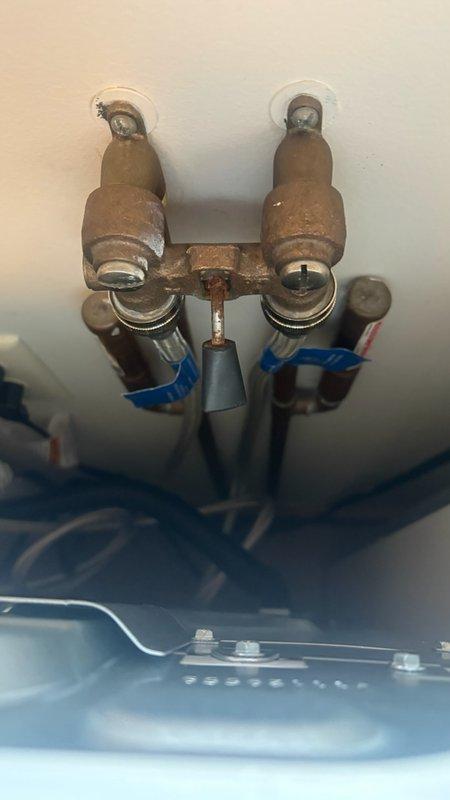 Responded to multiple water leak issues throughout the residence. Diagnosed and provided estimate for replacement of leaking laundry room shut-off valve, which showed significant corrosion and active leaking behind the washing machine. Assessed master bathroom cold water faucet leak and determined cartridge replacement necessary; provided estimate for installation of customer-supplied faucet fixture. Inspected previously repaired attic leak to verify repair integrity and determine any additional service requirements. Documented all leak locations and plumbing conditions with photographs for record and estimate purposes.