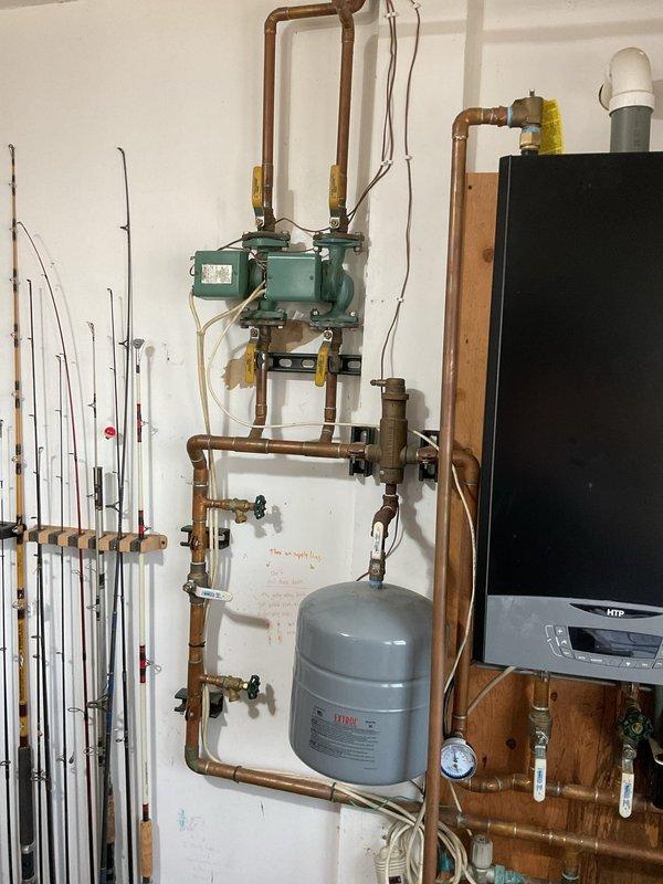 Responded to service call for HTP high-efficiency boiler requiring intermittent system resets when temperature was adjusted. Upon inspection, discovered loose TT wire connection on zone pump that was preventing boiler from responding to heat calls. Secured and properly terminated all loose wiring at zone pump to restore reliable electrical connection. Verified boiler operation with no error codes present and system responding properly to thermostat calls. Instructed customer to note any error codes displayed if issue recurs for further diagnostic reference.
