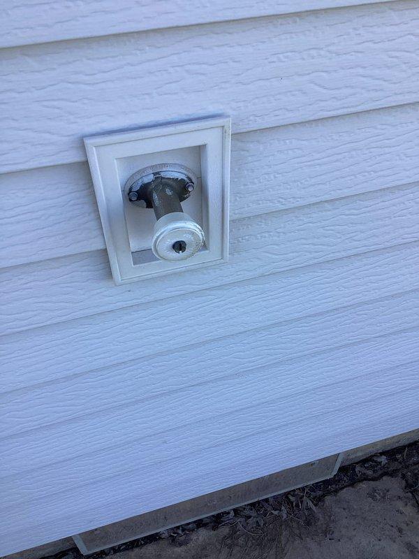 Replaced exterior hose bibb that was plumbed through crawl space, installing new frost-free spigot in recessed wall box with proper mounting to exterior siding. Rebuilt second hose bibb located at kitchen side of home, replacing worn valve assembly and ensuring proper shutoff function. Replaced hose bibb under kitchen sink, integrating new valve with existing water filtration system and supply lines while maintaining proper connections to copper supply pipes and PVC drain assembly.