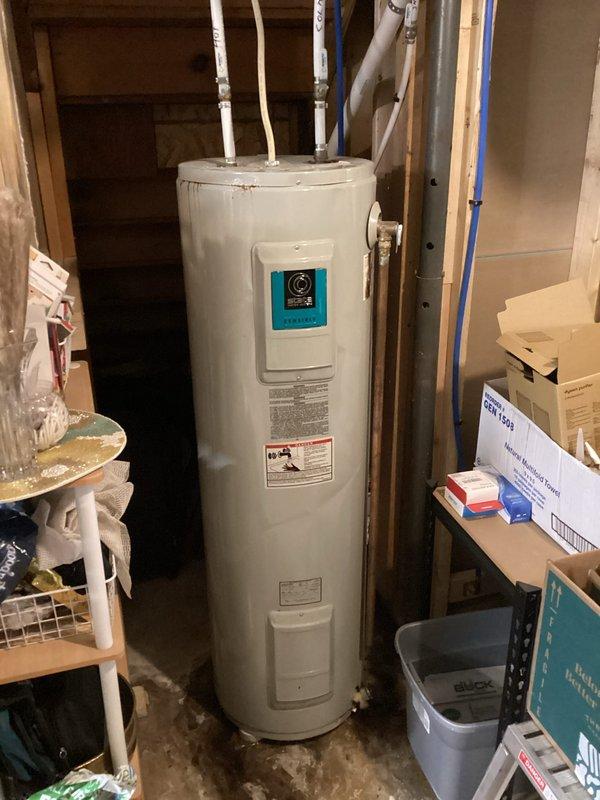 Responded to a leaking water heater emergency and removed the failed unit. Installed a new 50-gallon electric water heater with expansion tank in the residential utility space, connecting all supply lines using PEX plumbing with proper hot and cold water configurations. Completed full system testing to verify proper heating operation and confirmed no leaks at connections or tank fittings.