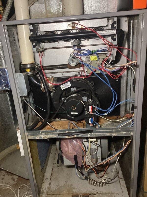 Completed comprehensive furnace tune-up including full system inspection and performance verification. Inspected heat exchanger and confirmed no cracks or compromises present. Evaluated air filter and evaporator coil, finding both heavily soiled with accumulated debris. Tested all electrical connections and components, confirming readings within manufacturer specifications. Verified condensate drain lines clear and draining properly.

Identified exhaust vent termination positioned too close to exterior siding, causing combustion gases to re-circulate near air intake. Installed 2-inch PVC coupling with 12-inch extension to redirect exhaust away from structure and prevent re-entrainment of flue gases. Recommended air filter replacement to restore proper airflow and system efficiency. Homeowner declined filter service and indicated plans to address evaporator coil condition during upcoming air conditioning system replacement. All systems operational and safe for continued use.