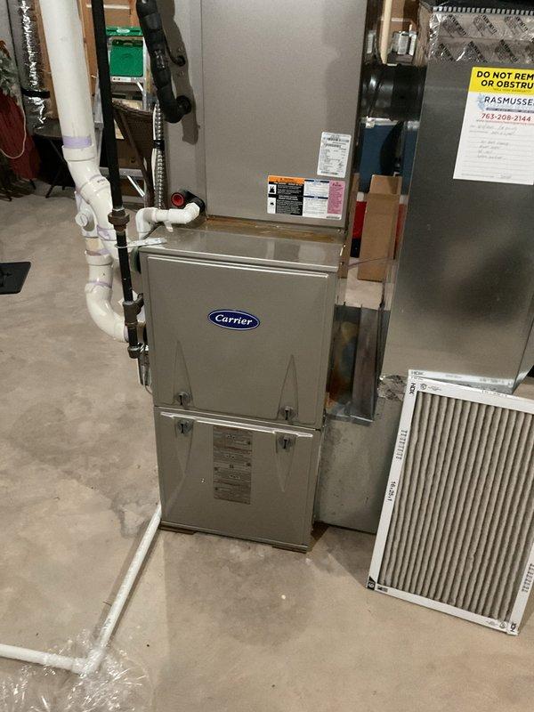 Performed comprehensive HVAC system inspection on 11-year-old Carrier heating and cooling system. Diagnosed thermostat failure preventing furnace operation and system activation. Completed full air conditioning tune-up with no operational issues identified. Inspected zoning system and identified failed basement zone damper stuck in closed position. Provided estimate for replacement of both older-style zone dampers to restore proper airflow distribution throughout home. Ordered replacement dampers for installation. Verified outdoor condenser unit operating within normal parameters with no refrigerant leaks or electrical concerns. System ready for damper replacement upon parts arrival.