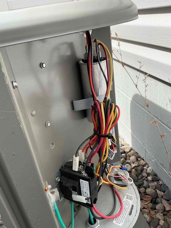 Responded to no-cooling complaint on 1-year-old Lennox air conditioning system. Upon arrival, determined unit had been operated during cold weather conditions, causing system lockout. Performed system reset and verified proper startup sequence. Unit cycled on successfully and operated normally. Completed AC tune-up maintenance including inspection of outdoor condenser unit, electrical connections, and refrigerant lines. All components functioning as designed at time of departure.