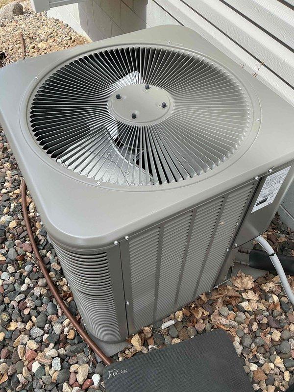 Responded to no-cooling complaint on 1-year-old Lennox air conditioning system. Upon arrival, determined unit had been operated during cold weather conditions, causing system lockout. Performed system reset and verified proper startup sequence. Unit cycled on successfully and operated normally. Completed AC tune-up maintenance including inspection of outdoor condenser unit, electrical connections, and refrigerant lines. All components functioning as designed at time of departure.
