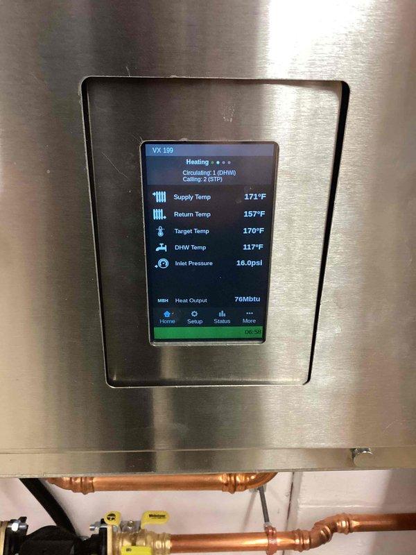 Responded to no hot water complaint on tankless water heater system. Upon arrival, confirmed system was experiencing same issue as previous February service call with tank temperature reading 56°F. Diagnosed circulating pump failure to activate, preventing hot water distribution throughout the system. Successfully restored circulating pump operation, returning system to normal functionality. Verified proper operation of VX 109 control panel displaying supply temperature of 171°F, return temperature of 157°F, and DHW temperature of 117°F. Confirmed all system parameters within normal operating range and hot water delivery restored.