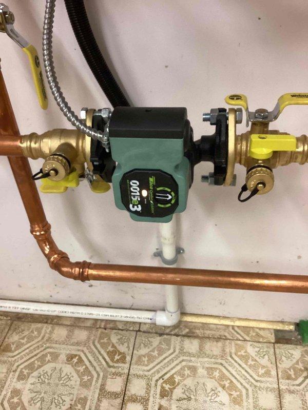 Responded to no hot water complaint on tankless water heater system. Upon arrival, confirmed system was experiencing same issue as previous February service call with tank temperature reading 56°F. Diagnosed circulating pump failure to activate, preventing hot water distribution throughout the system. Successfully restored circulating pump operation, returning system to normal functionality. Verified proper operation of VX 109 control panel displaying supply temperature of 171°F, return temperature of 157°F, and DHW temperature of 117°F. Confirmed all system parameters within normal operating range and hot water delivery restored.