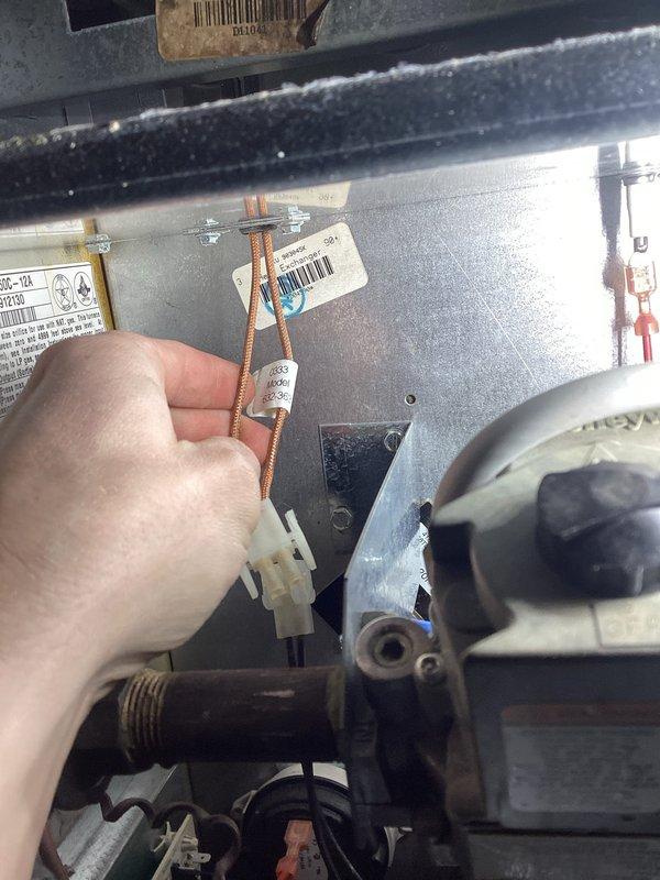 Responded to no heat call on 2-year-old Gibson furnace. Upon arrival, confirmed furnace was attempting to run but producing no heat. Diagnosed failed hot surface igniter - verified proper voltage output from control board during igniter call, but igniter measured open line (OL) on ohmmeter, confirming element failure. Gas valve was opening as designed but no ignition occurring due to failed igniter component.

During diagnostic process, observed blower motor exhibited labored startup indicating potential bearing wear or motor degradation. Conducted visual inspection of heat exchanger and documented areas of concern, though no active cracks or breaches were detected at time of inspection. Found air filter heavily restricted with debris, contributing to system stress.

Required igniter not available on service vehicle. Documented findings with photographs showing internal components and heat exchanger condition. Provided customer with complete assessment including failed igniter requirin