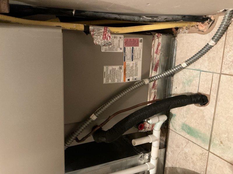 Completed comprehensive AC tune-up on 20-year-old system as part of family rewards maintenance agreement. Performed thorough inspection of all electrical components with capacitor testing at specification (40/5 MFD), pressure-washed and cleaned condenser coil, verified indoor evaporator coil condition and proper condensate drainage, inspected air filter and provided replacement, and conducted system operational test achieving 22-degree temperature split with all components functioning within normal parameters despite cold ambient conditions.