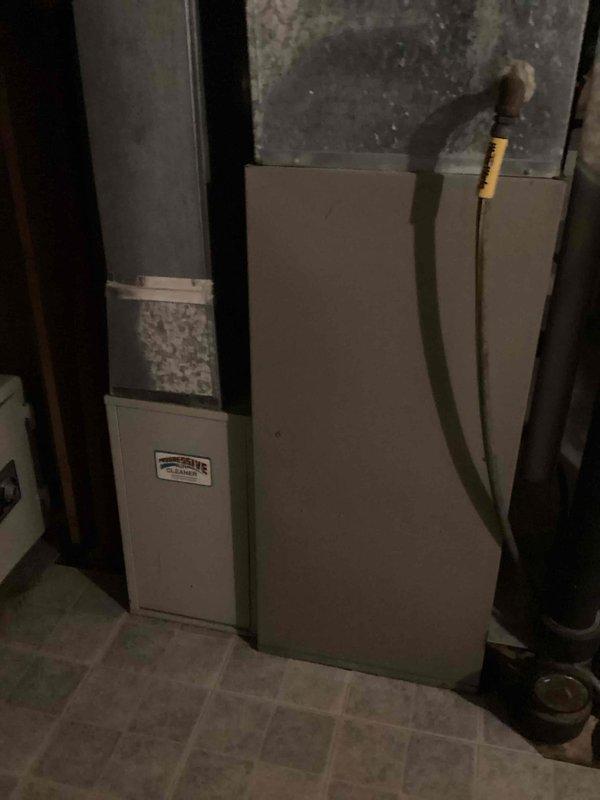 Responded to report of water heater leak in mechanical utility area. Upon inspection, determined that water heater was functioning properly with no leaks present. Identified actual source of water as disconnected condensate drain line from furnace unit. Reconnected condensate tubing to proper fitting and verified secure connection to prevent future water discharge onto floor.